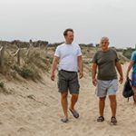 Elderly father and son walking on the beach; homes for sale in Point Pleasant NJ provide health benefits
