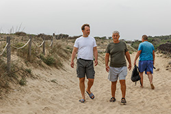 Elderly father and son walking on the beach; homes for sale in Point Pleasant NJ provide health benefits